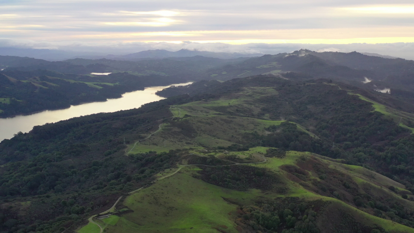 Winter rains cause lush green grass and foliage to grow in the peaceful hills of the East Bay, just east of Oakland, Berkeley, and El Cerrito in the San Francisco Bay Area.