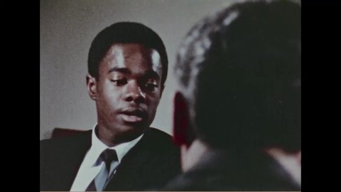 CIRCA 1968 - An employer interviews a job applicant, a high school dropout, about his reading comprehension skills.