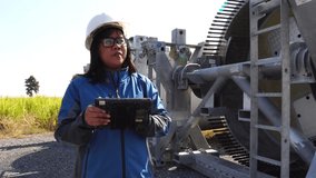 An engineer evaluates wind turbine with a tablet footage 4k