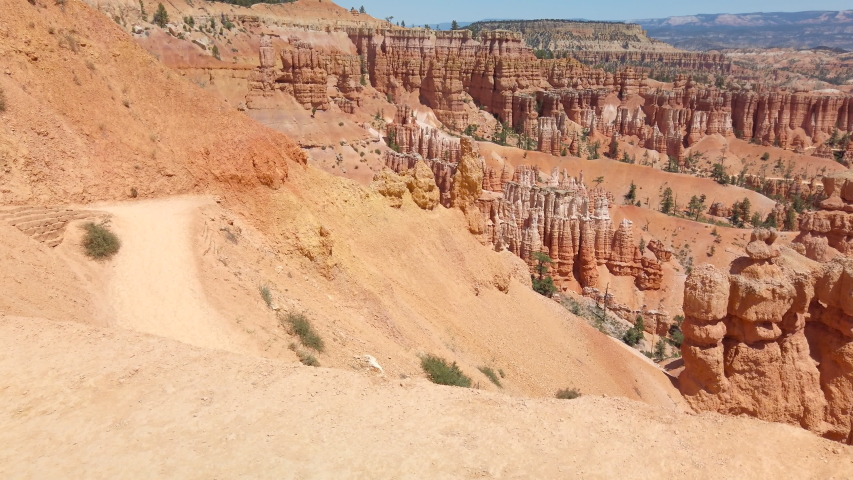 Young woman travels Bryce Canyon national park in Utah, United States, people travel explore nature. Bryce is a collection of giant natural amphitheaters distinctive due Hoodoos geological structures