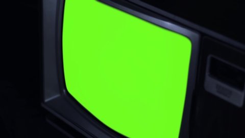 Old Retro Television with Color Bars and Green Screen. High Angle View. Close-Up. Blue Dark Tone. You can Replace Green Screen with the Footage or Picture you Want with “Keying” effect in After E. 