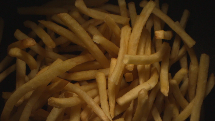 French Fries or Chips Floating in the Air Flying in Slow Motion on Black Background at 1500 fps 1080 version Royalty-Free Stock Footage #1043622655