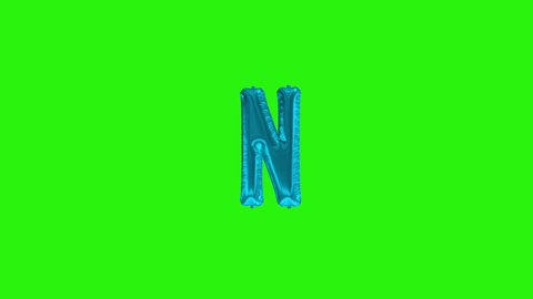 Blue letter N. Blue foil helium balloon alphabet floating on green screen