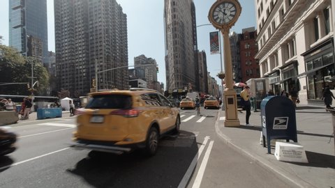 New York City - USA - Sep 27 2019: Tilt down view of busy traffic in the afternoon at Flatiron District Midtown Manhattan