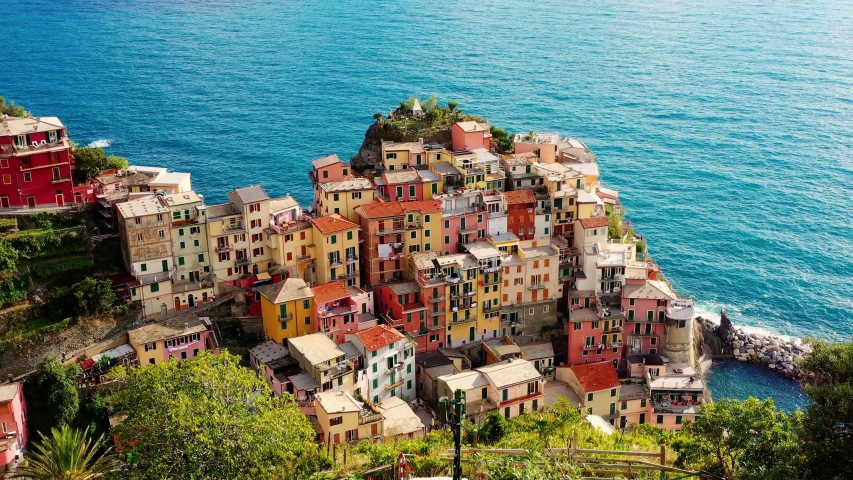 Village of Manarola in aerial view, Cinque Terre coast of Italy. Manarola is a small town in the province of La Spezia, in Liguria, in northern Italy and one of the Cinque Terre attractions Royalty-Free Stock Footage #1043656717