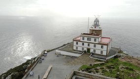 Aerial drone view of the Finisterre lighthouse in Spain at the so-called end of the world. It is the end point of the Saint James Walk for pilgrims. It is a winter day on the Atlantic with high waves.
