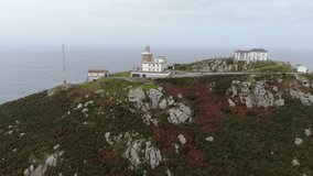 The Cape of Finisterre from a distance. Aerial drone view. The Lighthouse in Spain at the so-called end of the world. It is the end point of the Saint James Walk for pilgrims. It is a winter day.