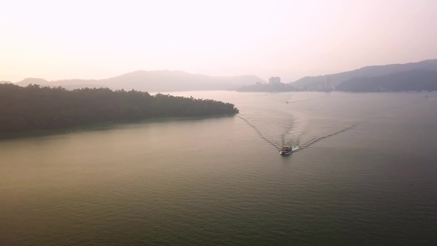 Aerial shot of boat in Sun Moon Lake,Taiwan Royalty-Free Stock Footage #1043678653