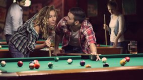 happy young people enjoying billiard game together - Powered by Shutterstock - Get 15% off with code: PIKWIZARD15