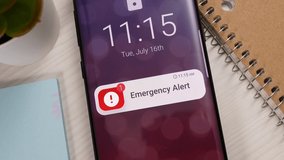 Smartphone showing an emergency notification banner appearing on the lock screen. Mobile phone alert warning. - Powered by Shutterstock - Get 15% off with code: PIKWIZARD15