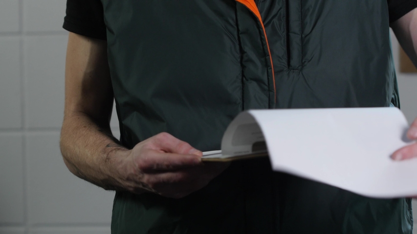 Young construction worker looks at plans