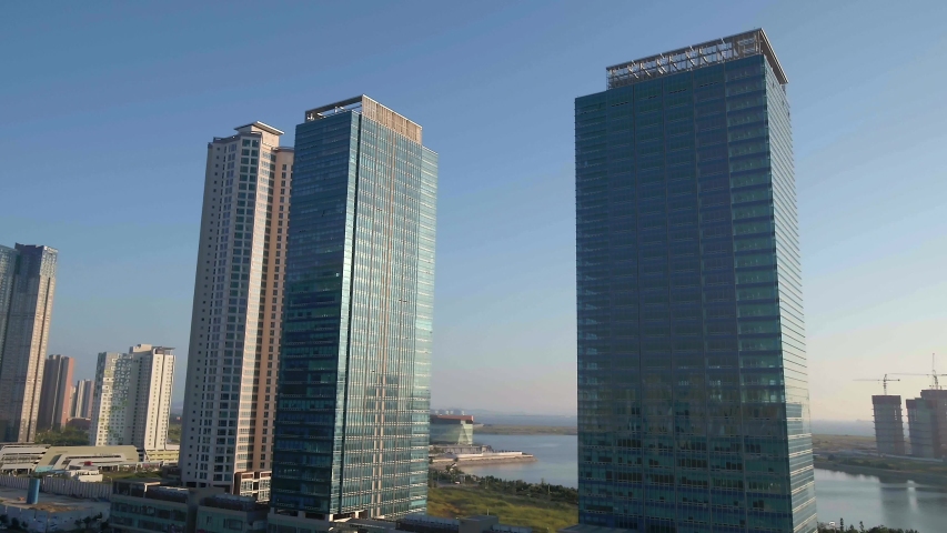 Drone shot of Songdo International Business District and skyscrapers at Incheon, S.Korea