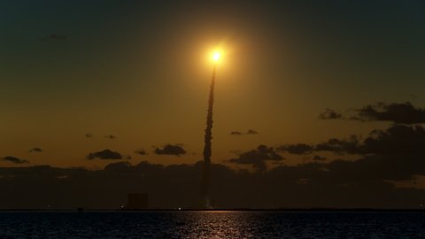 A NASA rocket launch lifts off from Cape Canaveral Florida carrying a Starliner space capsule to the International Space Station bringing supplies to astronauts. With Audio.