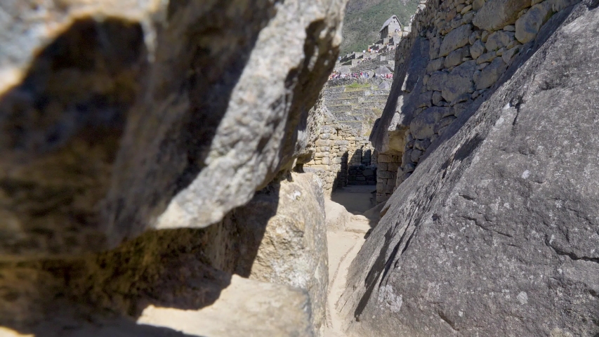 Passages, paths and walls made with stone blocks. Houses, temples and constructions made by the Incas in the citadel of Machu Picchu, Cusco region, Peru
