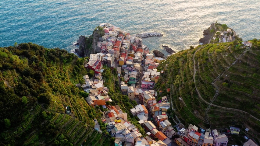 Village of Manarola in aerial view, Cinque Terre coast of Italy. Manarola is a small town in the province of La Spezia, in Liguria, in the north of Italy, magnificent seen from the Italian coast Royalty-Free Stock Footage #1043725513