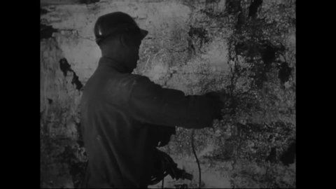 CIRCA 1940s - Coal miners go underground, check for gases, and blast as the narrator explains which parts of the mine should be destroyed in wartime.