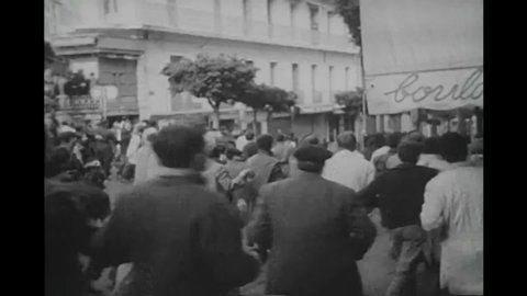CIRCA 1950s - Violent demonstrators in Algeria riot against the French military presence, Algerian revolution, 1950s