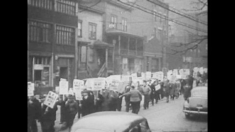 CIRCA 1940s - Various chapters of Unions meet and strikers march with picket signs in 1948.