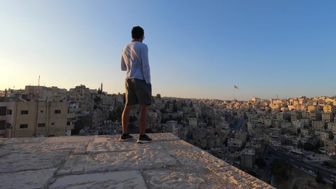 Man looking over the city of Amman in Jordan
