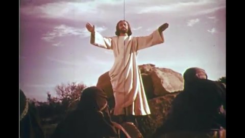 CIRCA 1952 - The resurrected Christ preaches to his followers by the sea of Galilee.
