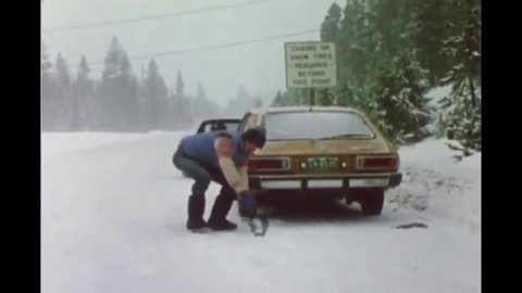 CIRCA 1982 - Safe winter driving is demonstrated.