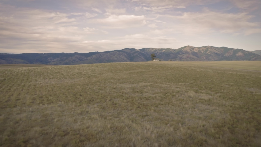 Aerial flying over an abandoned Haunted House on a farm. Idaho, USA 