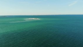 Drones Flies Towards Tiny Island In Super Blue Ocean