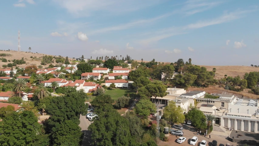 Ein Harod -  a kibbutz,  located in the north of the Israel, near Mount Gilboa. White Building - Museum of Art Ein-Harod. Videography from a drone.