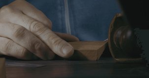 Close-Up Of Male Hands Marking A Wooden Detail With a Pencil For Making A Wooden Beard Comb. Handmade Craftsman Makes A Wooden Comb. Cinema 4K Video
