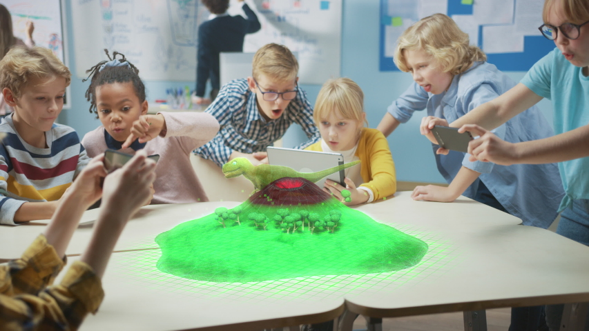 Group of School Children Use Digital Tablet Computers with Augmented Reality Software, Looking at Educational 3D Animation - Dinosaur Walking on Island with Active Volcano. VFX, Special Effects Render Royalty-Free Stock Footage #1043769202