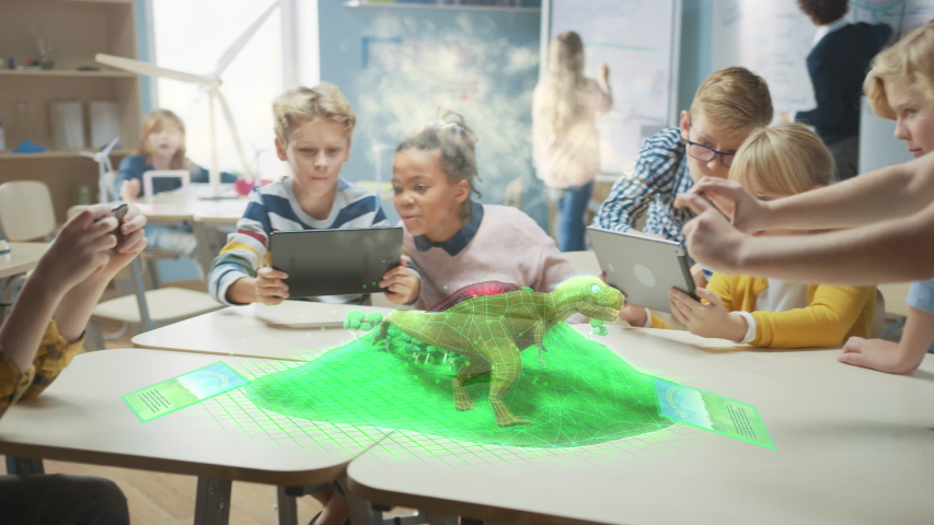 Group of School Children Use Digital Tablet Computers with Augmented Reality Software, Looking at Educational 3D Animation - Dinosaur Walking on Island with Active Volcano. VFX, Special Effects Render Royalty-Free Stock Footage #1043769202