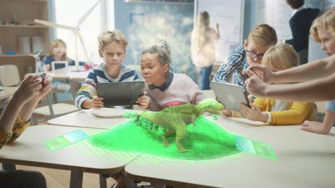 Group of School Children Use Digital Tablet Computers with Augmented Reality Software, Looking at Educational 3D Animation - Dinosaur Walking on Island with Active Volcano. VFX, Special Effects Render