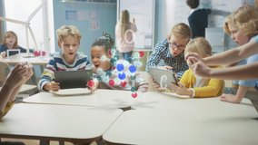 Group of School Children in Chemistry Science Class Use Digital Tablet Computers with Augmented Reality Software, Looking at Educational 3D Animation of a Molecule. VFX, Special Effects Render - Powered by Shutterstock - Get 15% off with code: PIKWIZARD15
