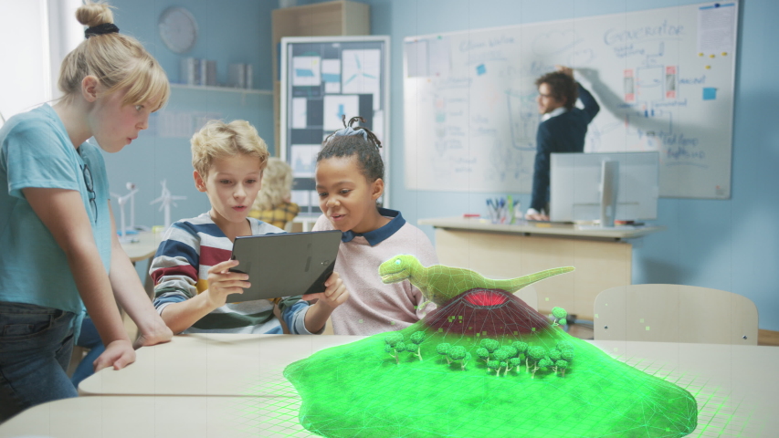 Three Diverse School Children Use Digital Tablet Computer with Augmented Reality Software, Looking at Educational 3D Animation - Dinosaur Walking on Island with Active Volcano. Special Effects FVX Royalty-Free Stock Footage #1043773135