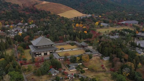 Aerial view of Buddhist temple Todaiji (Tōdai-ji) in city of Nara (Nara Park), one of Japan's most famous and historically significant temples in autumn - landscape panorama of Japan from above, Asia