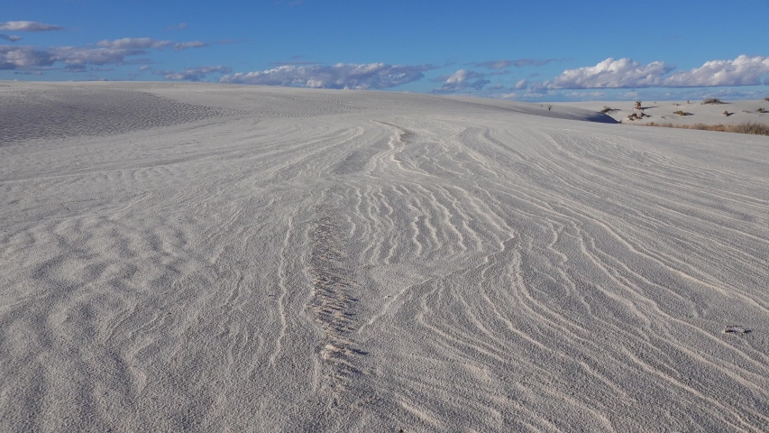 Waves on the white sand of gypsum in the White Sands National Monument in New Mexico, USA