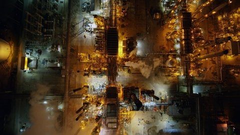 Toledo Ohio Aerial Nighttime oil refinery cityscape vertical back and forth with moving trucks - October 2017