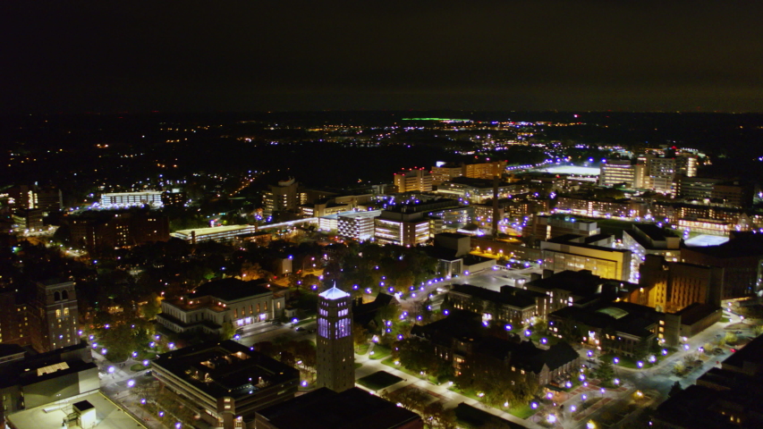 Ann Arbor Michigan Aerial Fast panoramic campus cityscape at night - October 2017
