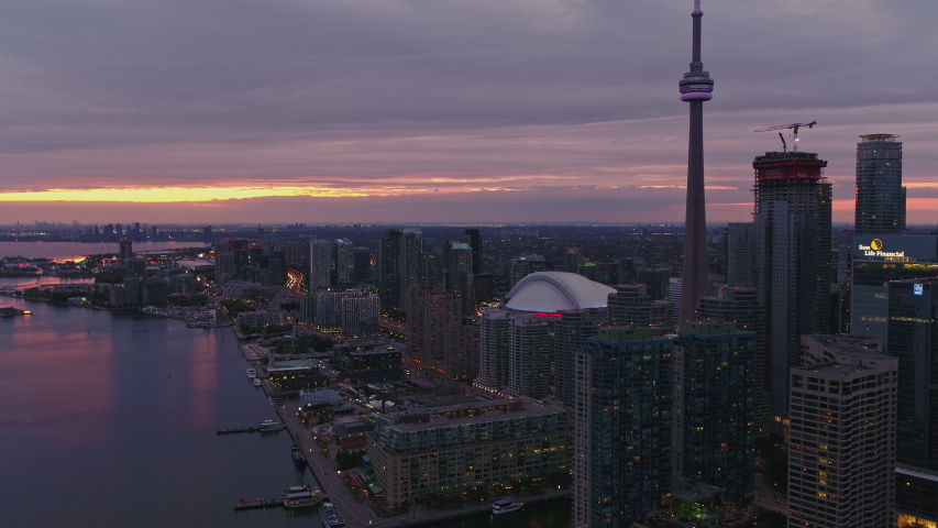 Toronto Ontario Aerial v47 Looking back at iconic sunset Inner Harbour skyline moving backwards - October 2017