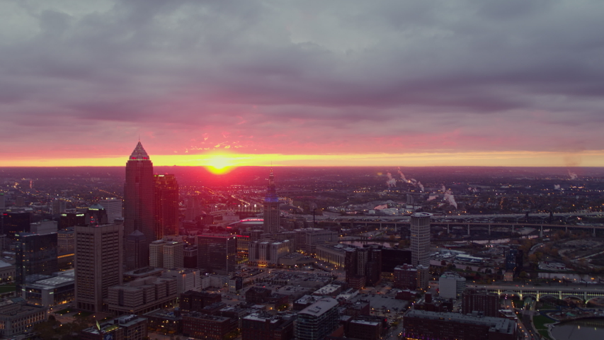 Cleveland Ohio Aerial Sunrise cityscape panning from downtown skyline toward Lake Erie - October 2017