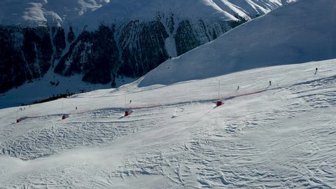 An aerial view of Livigno in winter, Skiers skiing in Livigno ski Alpine resort, Livigno, Italy, Europe