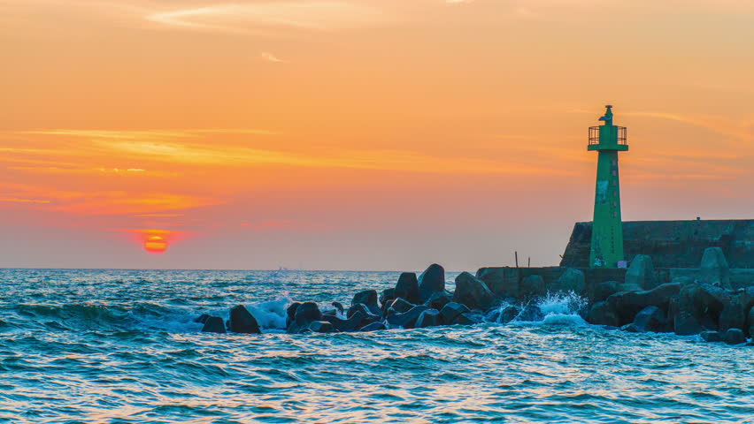 lighthouse under sunburst