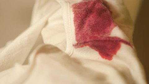 Close up dirty white panties in blood. Menstruation concept 4k video. Woman hygiene products