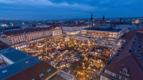 Day to night time lapse video of Dresden Striezelmarkt, one of the oldest Christmas markets in the World. Panoramic view.