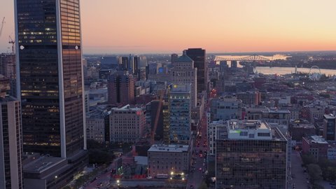 Aerial: Montreal City Skyline and Old Port at sunrise. Quebec, Canada 