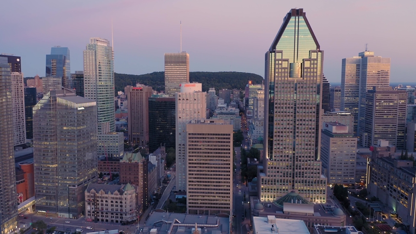 Aerial: Montreal City Skyline and traffic At sunrise. Quebec, Canada 