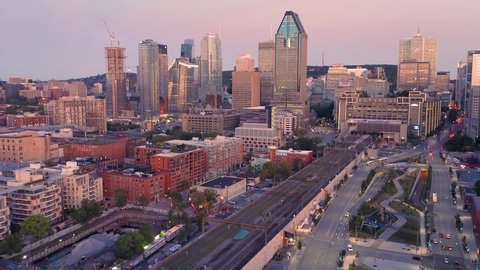 Aerial: Montreal City Skyline and traffic At sunrise. Quebec, Canada 
