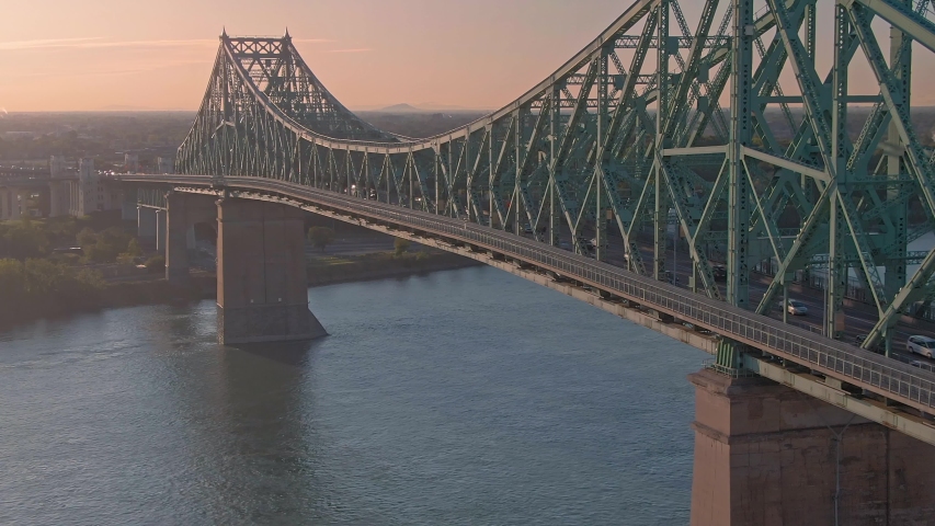 Aerial flying over traffic on the the Jacques Cartier Bridge. Montreal, Quebec, Canada. 