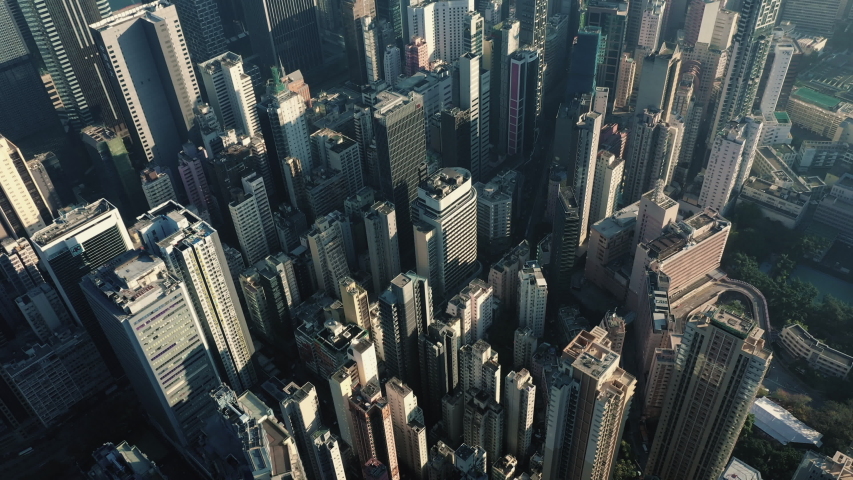 AERIAL. Cinematic video and Top view of Hong Kong city center at sunset and sun light. | Shutterstock HD Video #1043849830