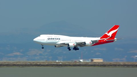 SAN FRANCISCO, CA - 2020: Qantas Boeing 747-400 Jet Airliner Landing on Runway at San Francisco SFO International Airport Arriving on a Sunny Day in California